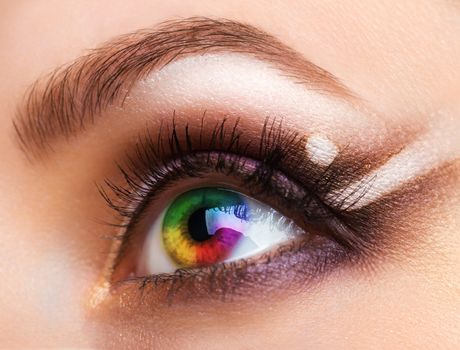 Close up Colourful human eye with makeup. Beauty and fashion