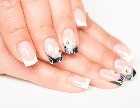 Beautiful female hands with manicure on a light background