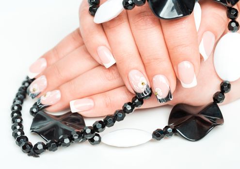 Female hands with manicure closeup on light background