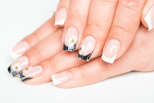 Beautiful female hands with manicure on a light background