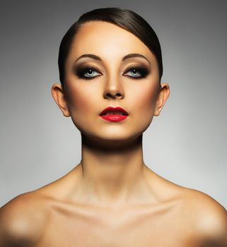 Portrait of a beautiful young woman with a glamorous retro makeup