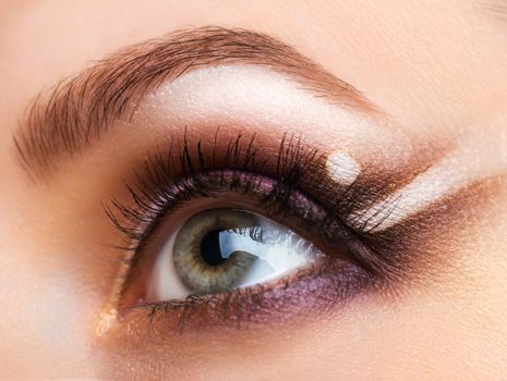 Closeup of beautiful womanish eye with glamorous makeup