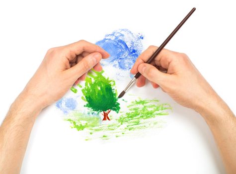 Human hands with brush painting nature landscape on white background