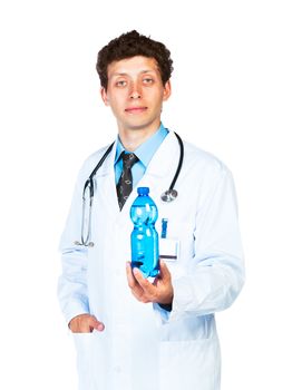 Portrait of a male doctor holding bottle of water on white background
