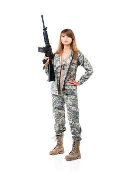 Soldier young beautyful girl dressed in a camouflage with a gun in his hand on white background