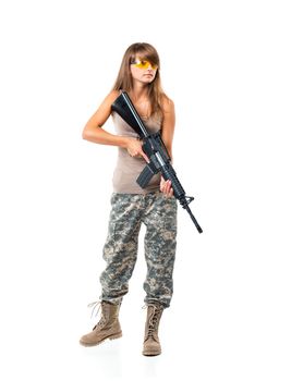 Soldier young beautiful girl dressed in a camouflage with a gun in his hand on white background