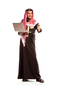 Young smiling arab with laptop isolated on white background