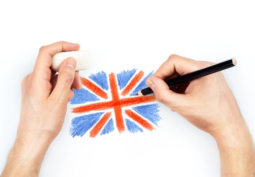 Man's hands with pencil draws flag of United Kingdom of Great Britan on white background