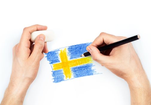 Man's hands with pencil draws flag of Sweden on white background