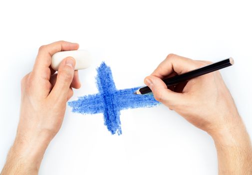 Man's hands with pencil draws flag of Finland on white background