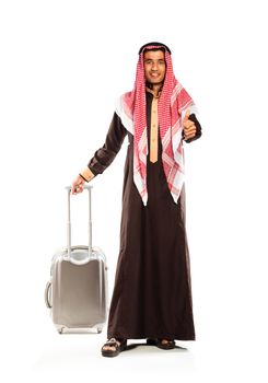 Young smiling arab with a suitcase isolated on white background