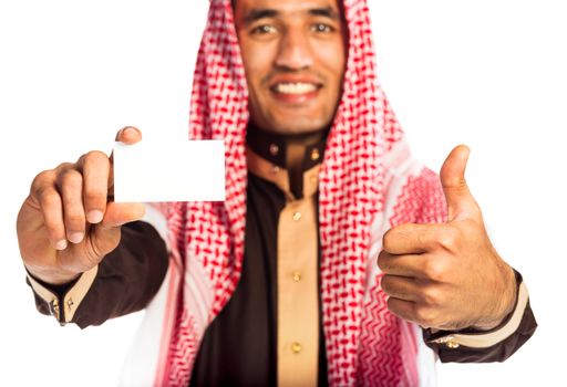 Young smiling arab showing business card in hand isolated on white background