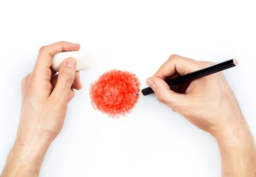 Man's hands with pencil draws flag of Japan on white background