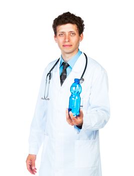 Portrait of a smiling male doctor holding bottle of water on white background