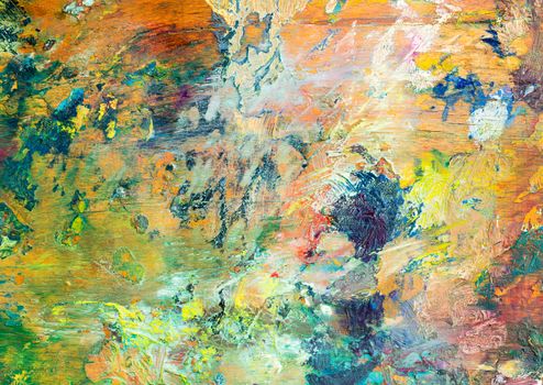 Colorful background made oil paints on a wooden background