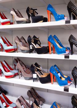 Background with shoes on shelves of shop