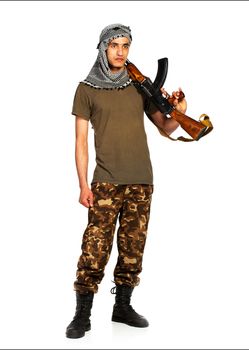 Arab nationality in camouflage suit and keffiyeh with automatic gun on white background with reflection