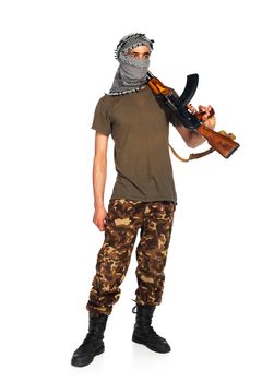 Arab nationality in camouflage suit and keffiyeh with automatic gun on white background with reflection