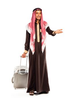 Young smiling arab with a suitcase isolated on white background