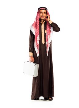 Young smiling arab with a aluminum case and cellphone isolated on white background