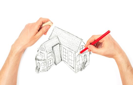 Hands drawing big house on a white background