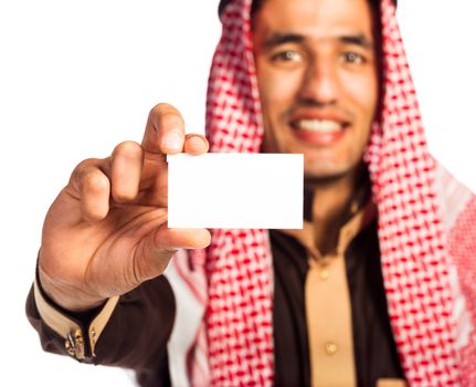 Young smiling arab showing business card in hand isolated on white background