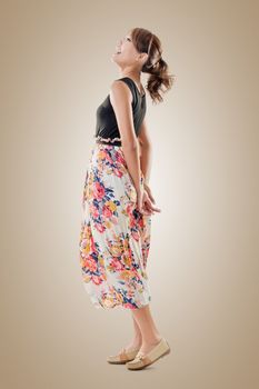 Attractive Asian woman with maxi dresses, full length isolated.