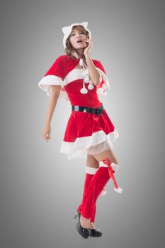 Sexy Christmas girl of Asian standing and smiling at the studio, full length portrait isolated.