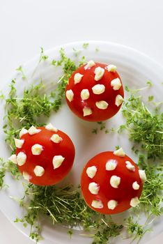 Fly mushroom formed from boiled egg, cover with the tomato mayonnaise. Funny food for children or party.