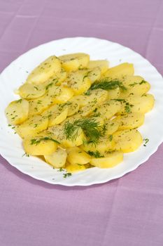 Delicious boiled potatoes with dill and olive