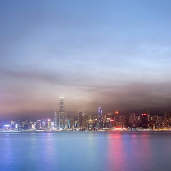 City night scenes of Victoria harbor in Hong Kong with copyspace on heaven.