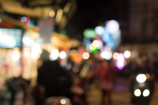 Abstract urban background with blurred buildings and street, shallow depth of focus.