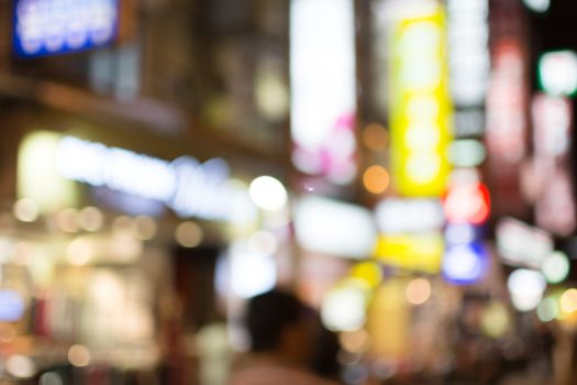 Abstract urban background with blurred buildings and street, shallow depth of focus.