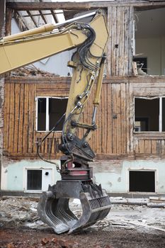 Close up of a Excavator demolish a House