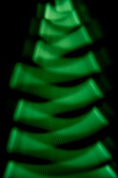 green fir shaped line texture over black 