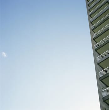 Skyscraper balconies against blue sky