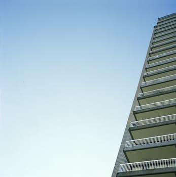 Skyscraper balconies against blue sky