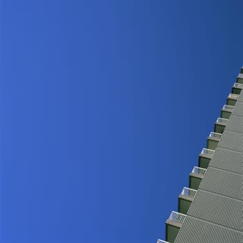 Skyscraper balconies against blue sky