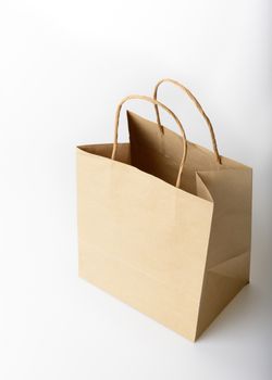 brown paper shopping bag on white background