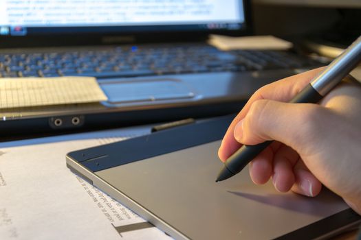 Close-up of a graphic tablet with his pen tool