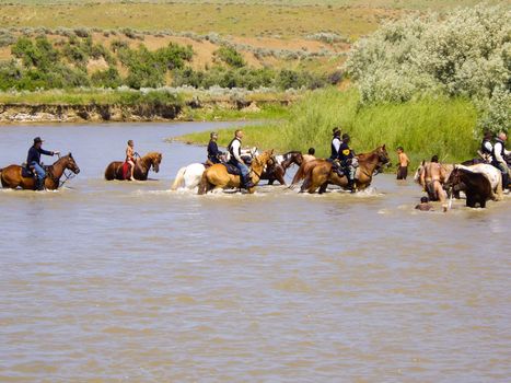Crow Agency, Montana USA - June 27, 2009: Reenactment of the Battle of the Little Bighorn known as Custer's Last Stand. Cavalry and Indians all clean up in the river after the reenactment.