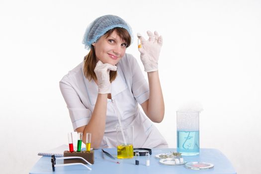 Young beautiful girl posing chemical experiments in the laboratory