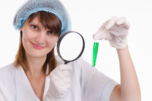 Young beautiful girl posing chemical experiments in the laboratory