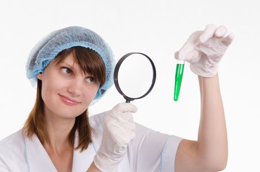 Young beautiful girl posing chemical experiments in the laboratory