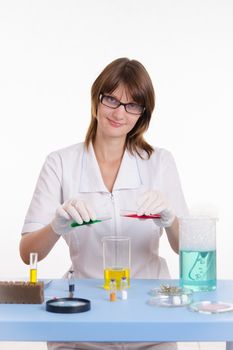 Young beautiful girl posing chemical experiments in the laboratory