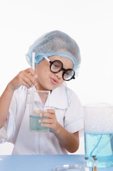 Girl sitting in chemistry class and makes the simplest experiments