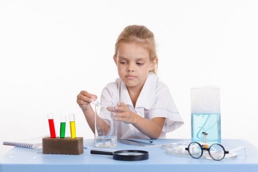 Pupil at a school desk in chemistry class