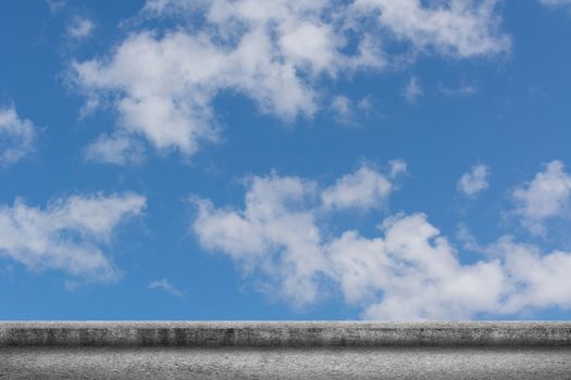 Background of concrete ground with cloudy sky.