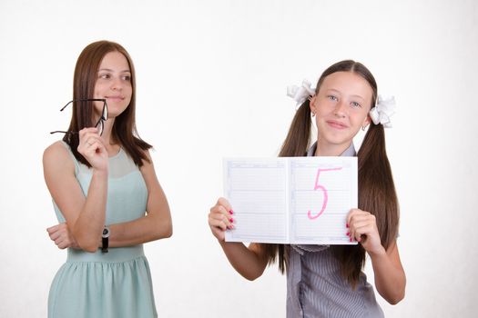 The teacher put five good a student