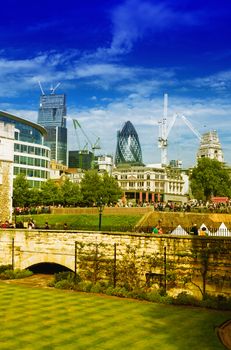 Gardens of Tower of London with city skyline on background.